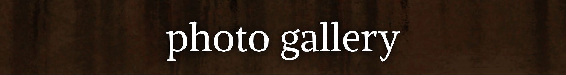 Rusted sign that reads 'Photo Gallery'